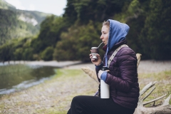 Woman drinking traditional argentinian yerba mate in Patagonia